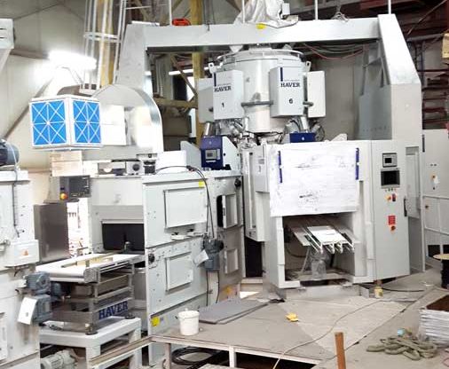 Montage d’un silo de 14m de hauteur et d’une machine rotatif à six bras de remplissage automatique de produit pour KNAUF